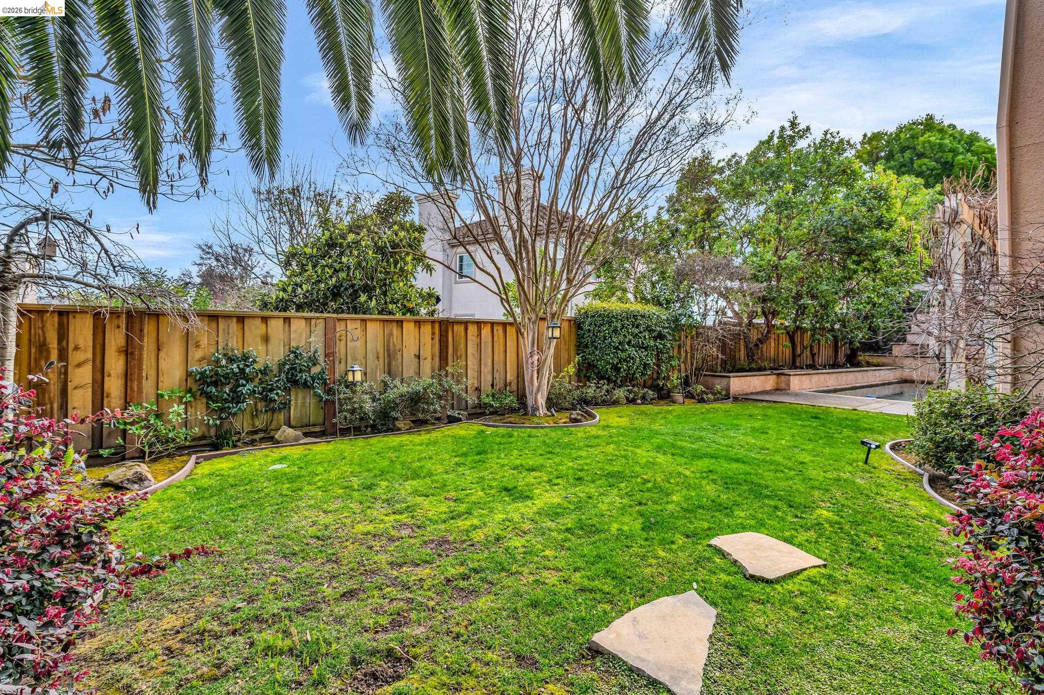 5 Circle E Ranch Place San Ramon, CA 94583 - Photo 32 of 60 a view of a backyard with plants and a lake view