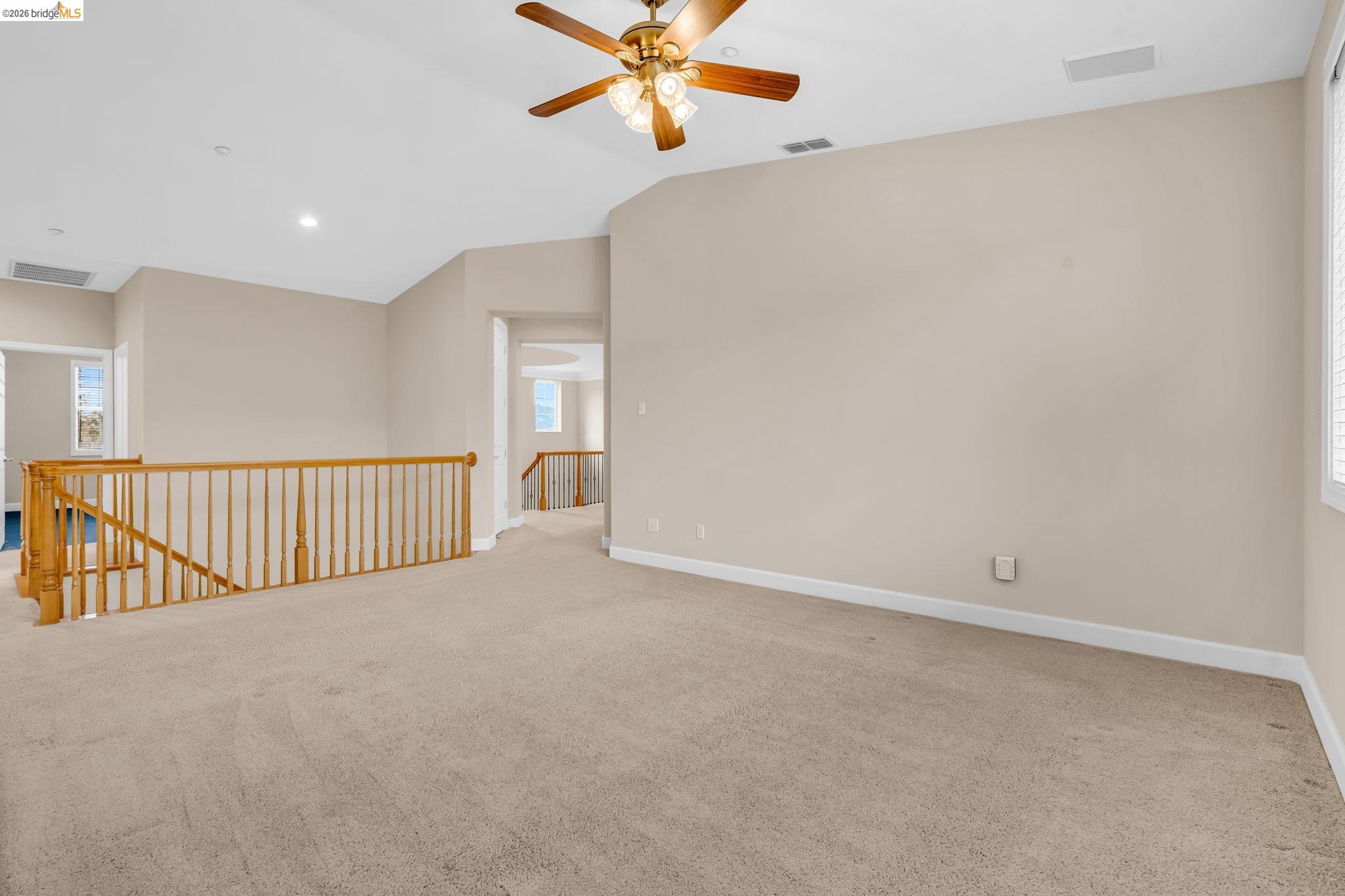 5 Circle E Ranch Place San Ramon, CA 94583 - Photo 38 of 60 a view of a hallway with a ceiling fan and a window