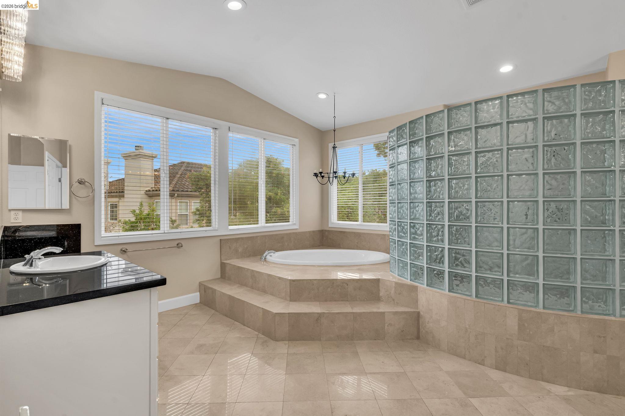 5 Circle E Ranch Place San Ramon, CA 94583 - Photo 44 of 60 a bathroom with a tub a sink and a large window