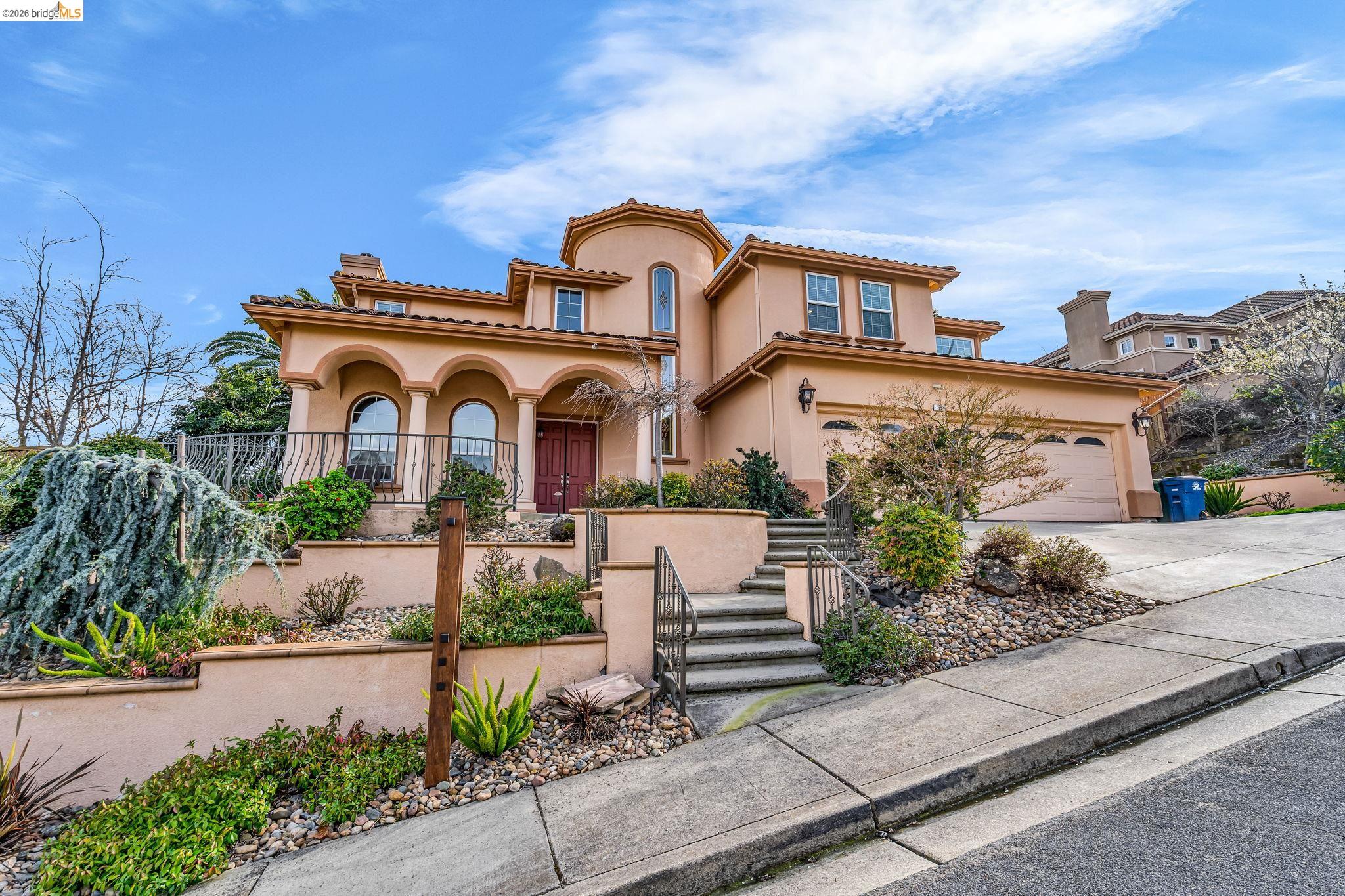 5 Circle E Ranch Place San Ramon, CA 94583 - Photo 5 of 60 Mediterranean / spanish house with stucco siding, concrete driveway, a chimney, covered porch, and a tiled roof