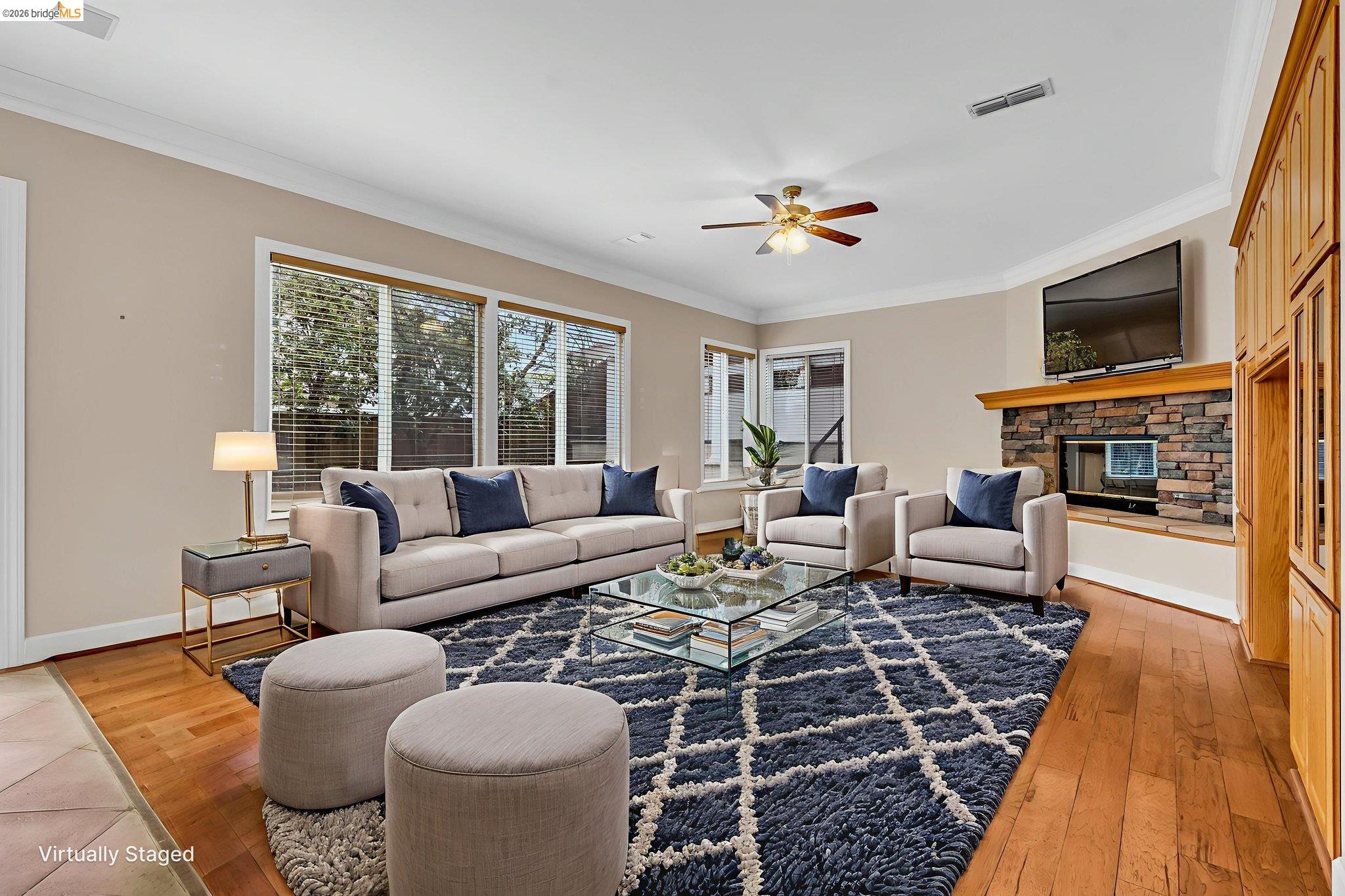5 Circle E Ranch Place San Ramon, CA 94583 - Photo 52 of 60 a living room with furniture a flat screen tv and a fireplace