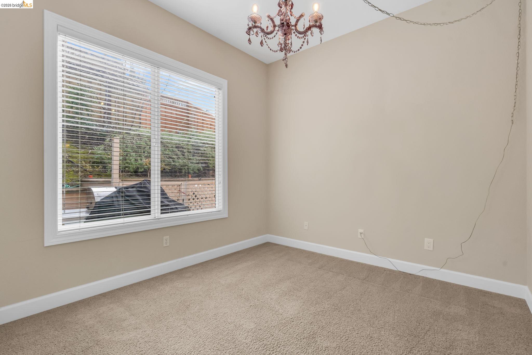 5 Circle E Ranch Place San Ramon, CA 94583 - Photo 58 of 60 Carpeted spare room featuring baseboards and hanging lights