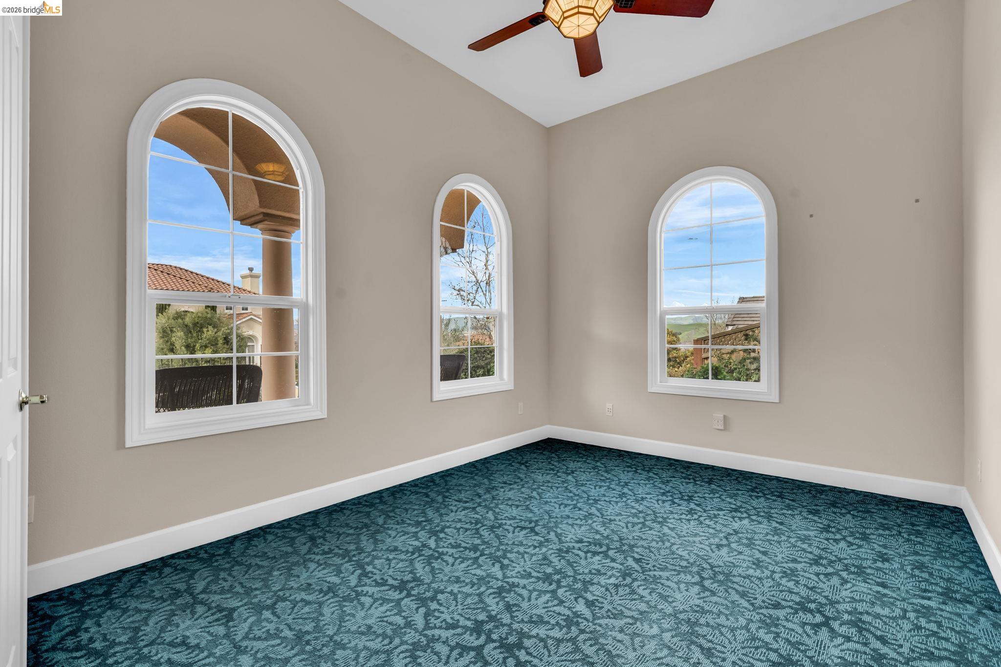 5 Circle E Ranch Place San Ramon, CA 94583 - Photo 6 of 60 Carpeted empty room with baseboards and ceiling fan