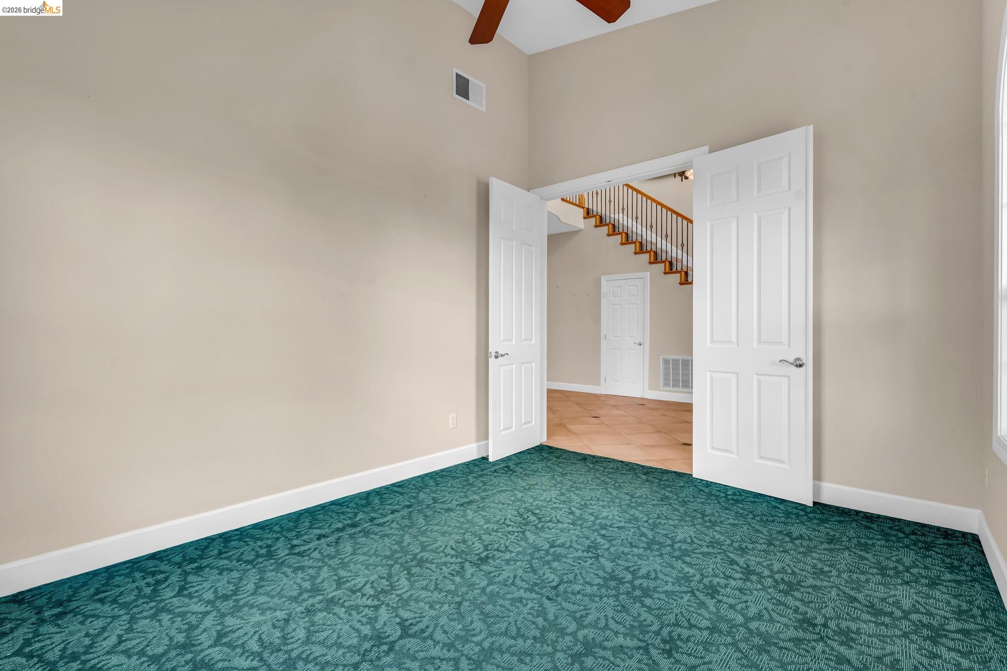 5 Circle E Ranch Place San Ramon, CA 94583 - Photo 7 of 60 Unfurnished bedroom with carpet floors, a high ceiling, and a ceiling fan