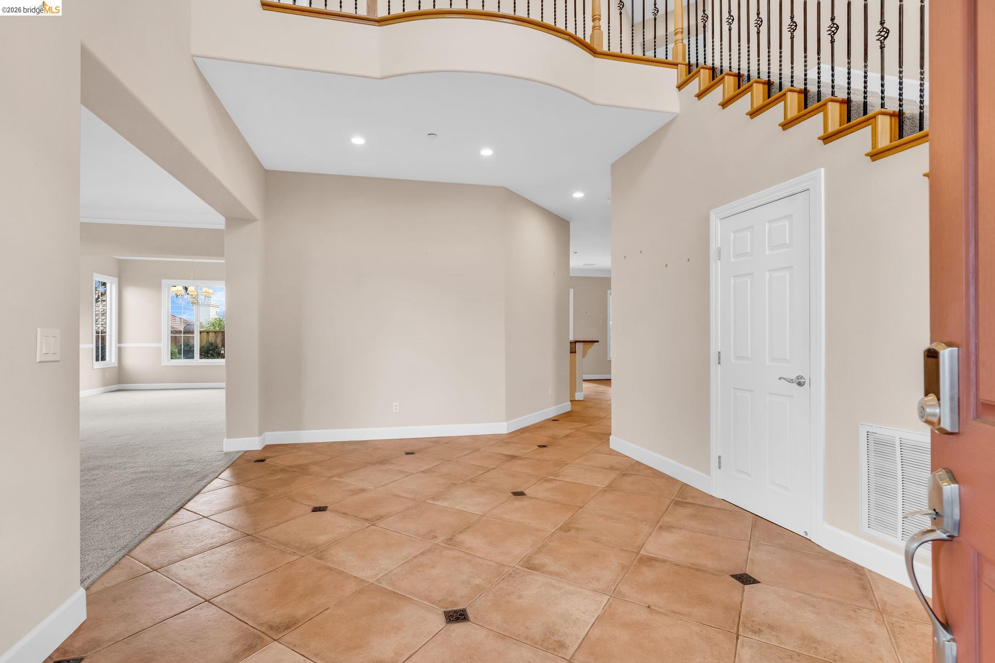 5 Circle E Ranch Place San Ramon, CA 94583 - Photo 10 of 60 Tiled foyer entrance with a high ceiling, carpet, and a chandelier