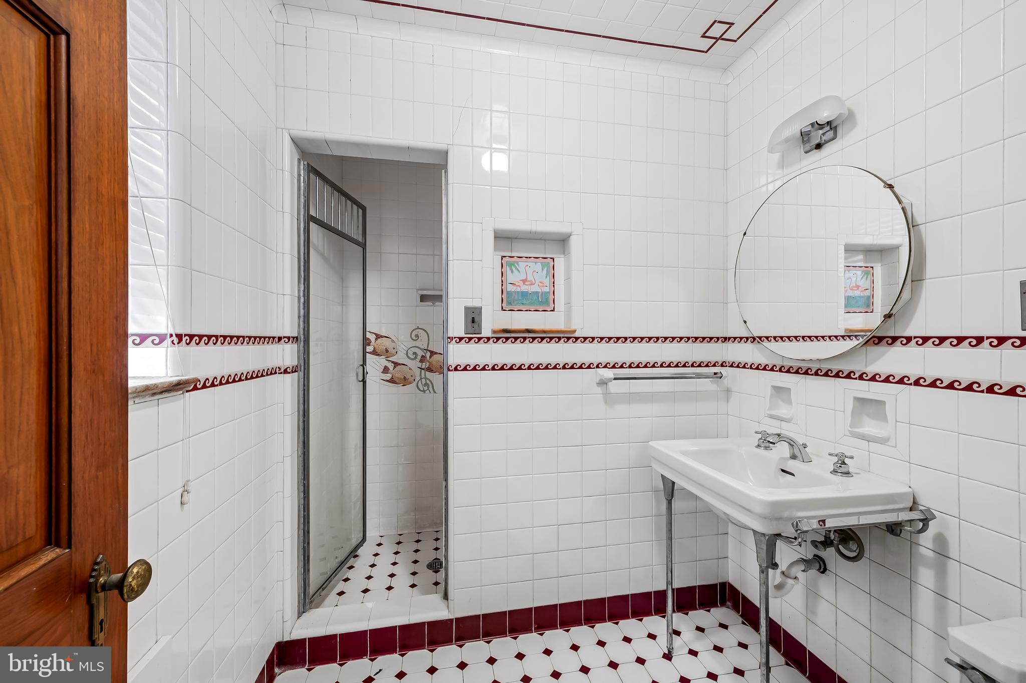 922 Fairway Drive Towson, MD 21286 - Photo 27 of 52 a bathroom with a sink and a mirror