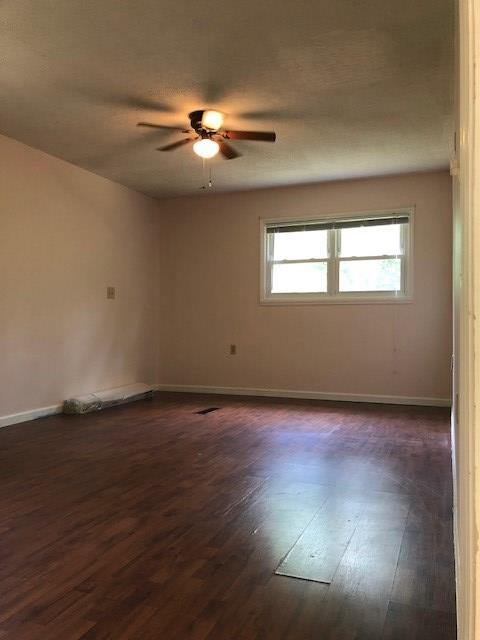 3685 Almond Road Fortson, GA 31808 - Photo 11 of 17 an empty room with wooden floor and windows