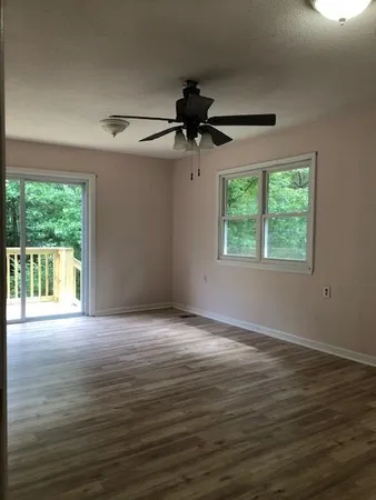 a view of an empty room with a window