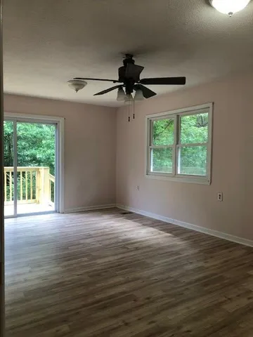 a view of an empty room with a window
