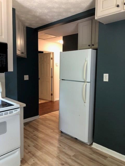3685 Almond Road Fortson, GA 31808 - Photo 6 of 17 a utility room with wooden floor washer and dryer
