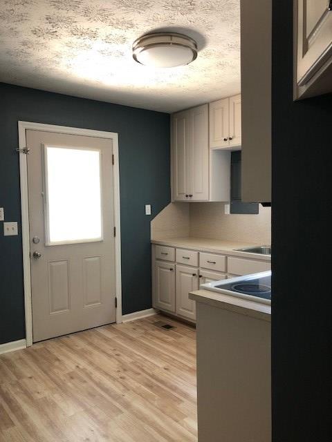 3685 Almond Road Fortson, GA 31808 - Photo 7 of 17 a kitchen with a stove and a refrigerator