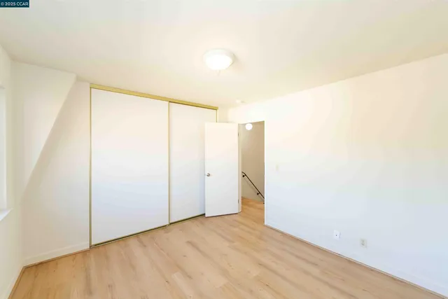 a view of staircase with white walls and a window