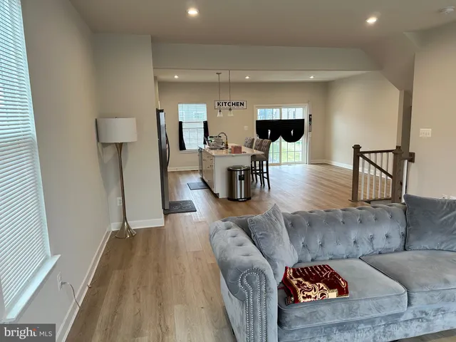 a bedroom with a bed and a potted plant