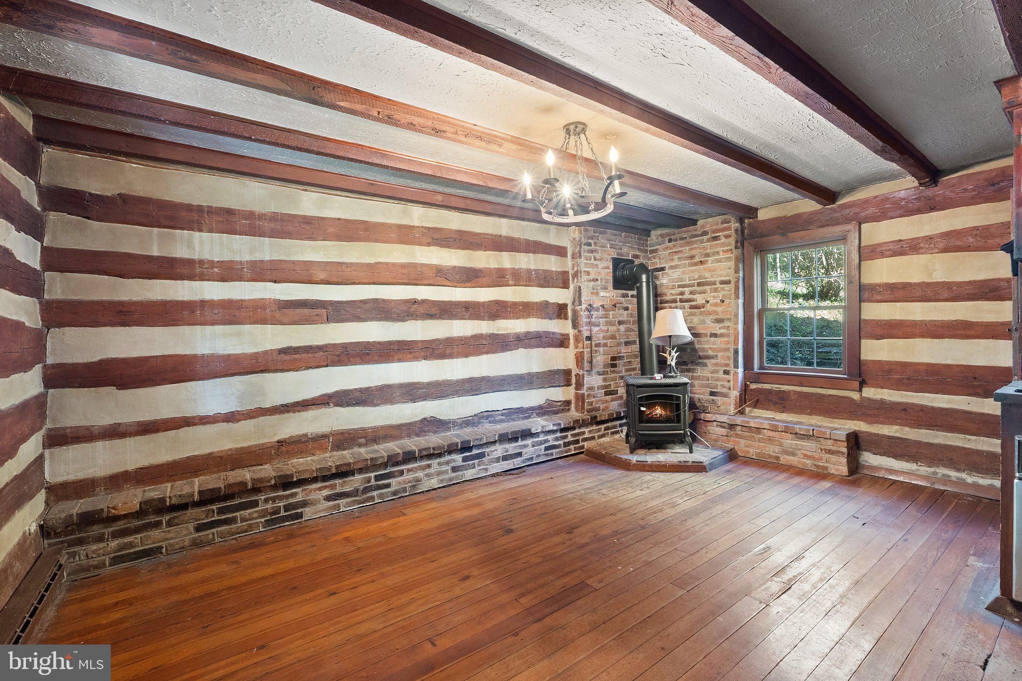 841 Shady Creek Road Clear Brook, VA 22624 - Photo 12 of 62 a view of room with wooden floor and a window