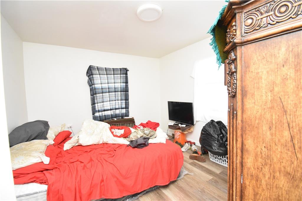 926 Island Avenue McKees Rocks, PA 15136 - Photo 13 of 21 a bedroom with a bed and a flat screen tv
