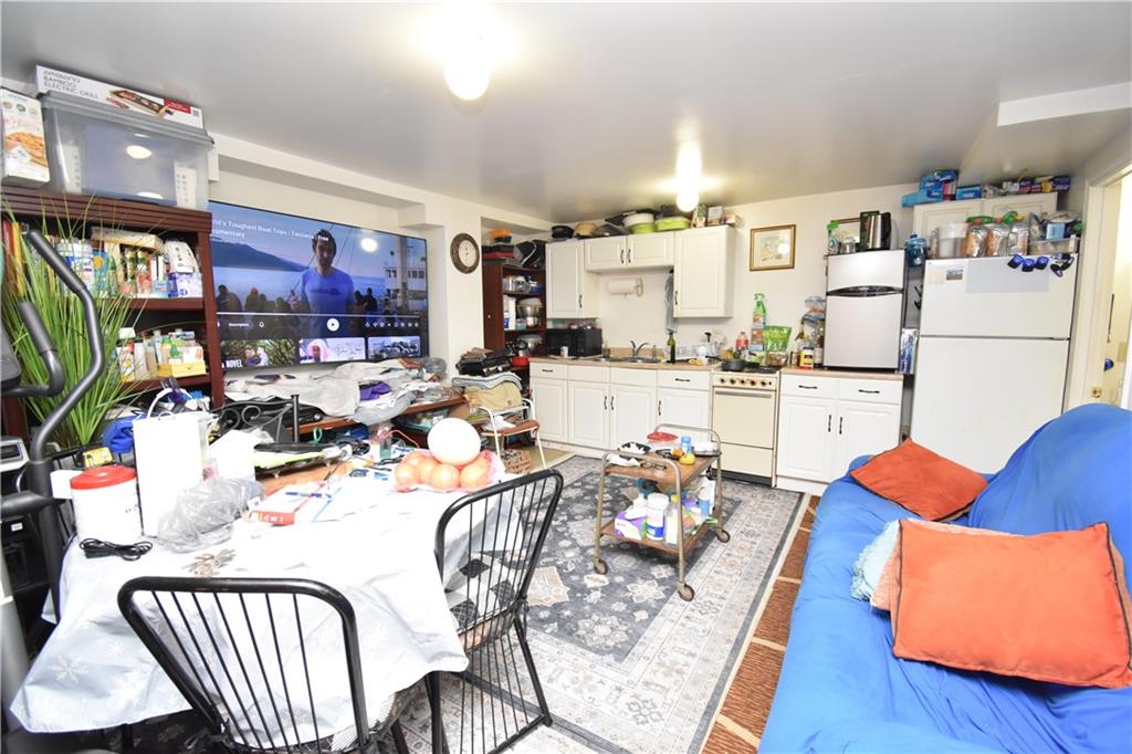 926 Island Avenue McKees Rocks, PA 15136 - Photo 16 of 21 a view of a dining room with furniture and a kitchen view