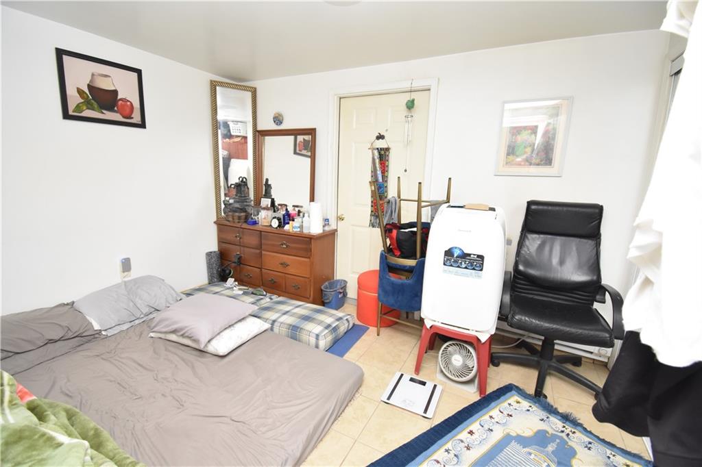 926 Island Avenue McKees Rocks, PA 15136 - Photo 17 of 21 a bed room with a bed and a table