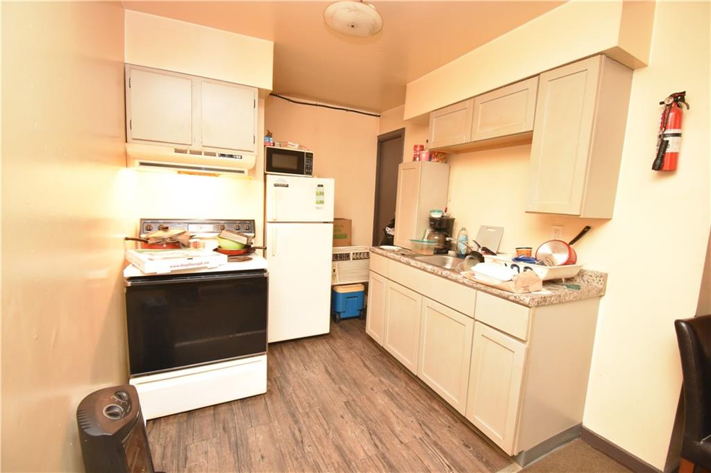 926 Island Avenue McKees Rocks, PA 15136 - Photo 4 of 21 a kitchen with a sink cabinets and appliances