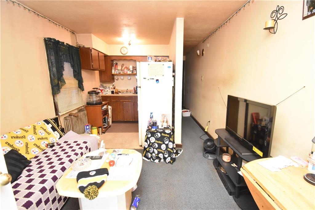 926 Island Avenue McKees Rocks, PA 15136 - Photo 7 of 21 a bedroom with a bed and flat screen tv
