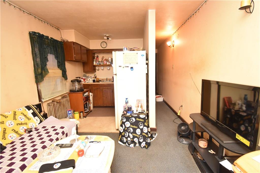 926 Island Avenue McKees Rocks, PA 15136 - Photo 10 of 21 a view of living room with furniture and flat screen tv