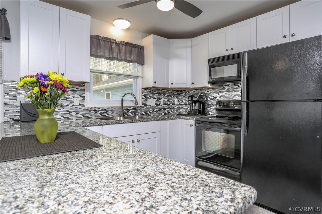 7463 Trailing Rock Road Prince George, VA 23875 - Photo 10 of 30 a kitchen with a refrigerator and a sink
