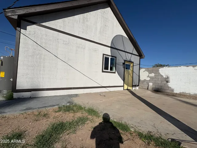 a view of a house with a street