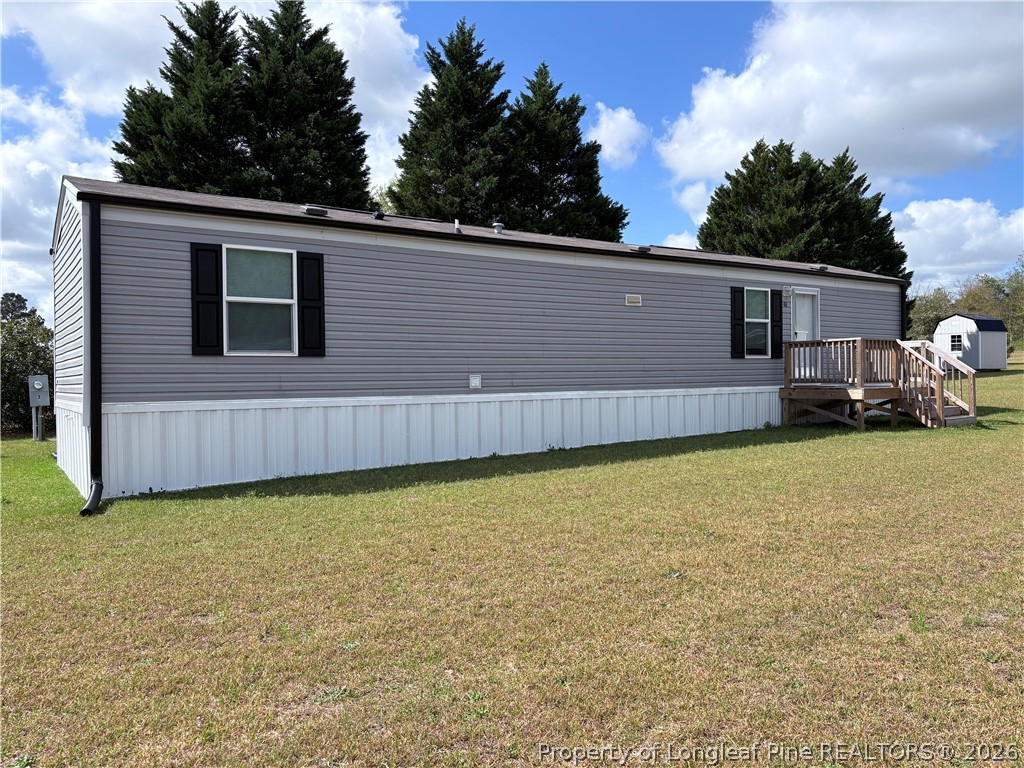 a backyard of a house with wooden fence