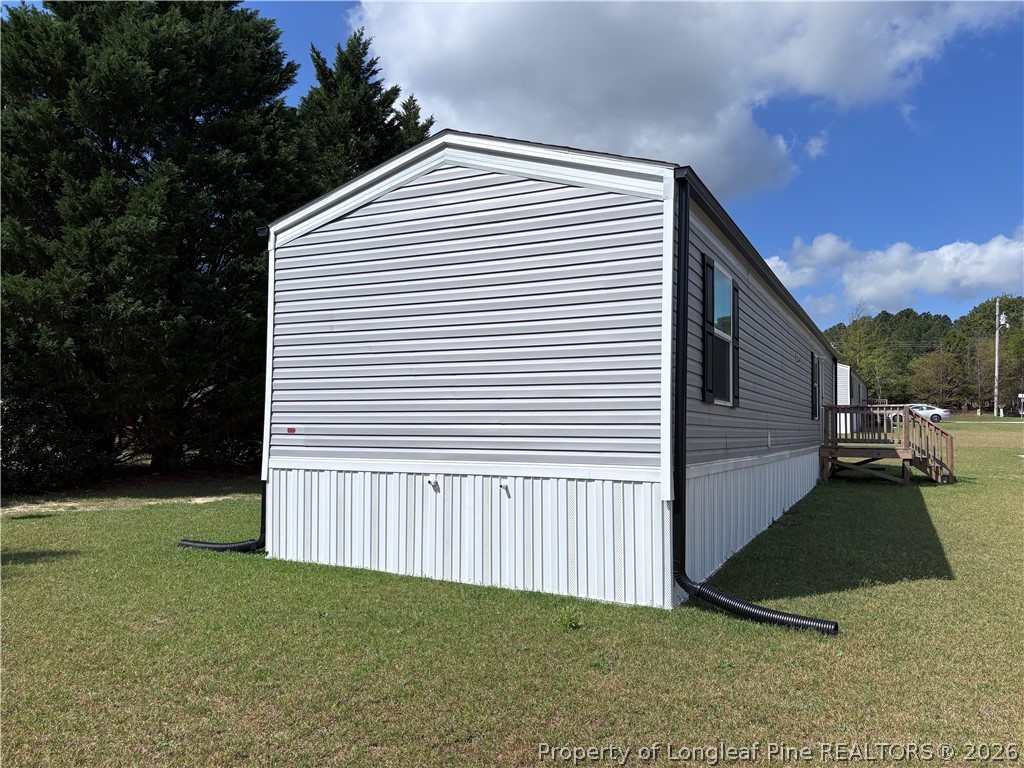 48 Britton Loop Cameron, NC 28326 - Photo 2 of 10 a view of a house with backyard