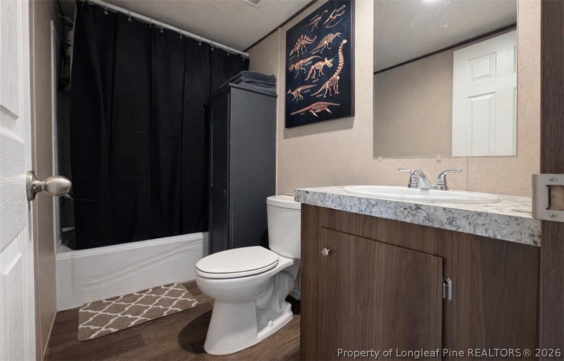 48 Britton Loop Cameron, NC 28326 - Photo 6 of 10 a bathroom with a granite countertop sink toilet and shower