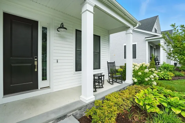 a front view of a house with garden