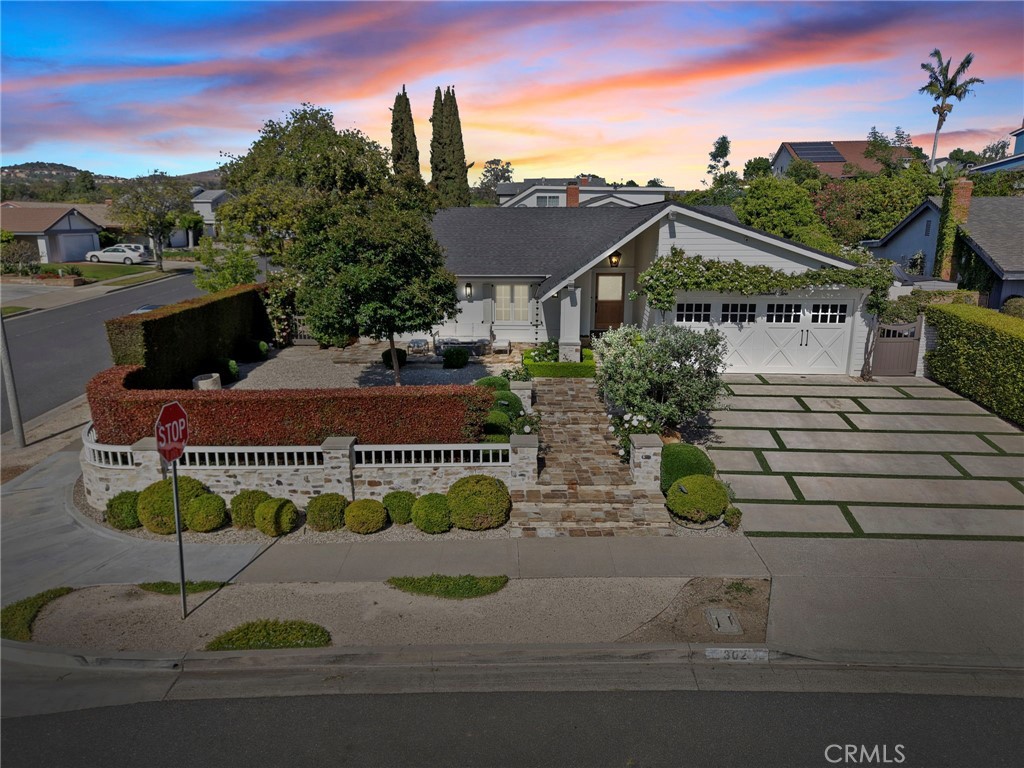 a aerial view of a house with swimming pool and lake view