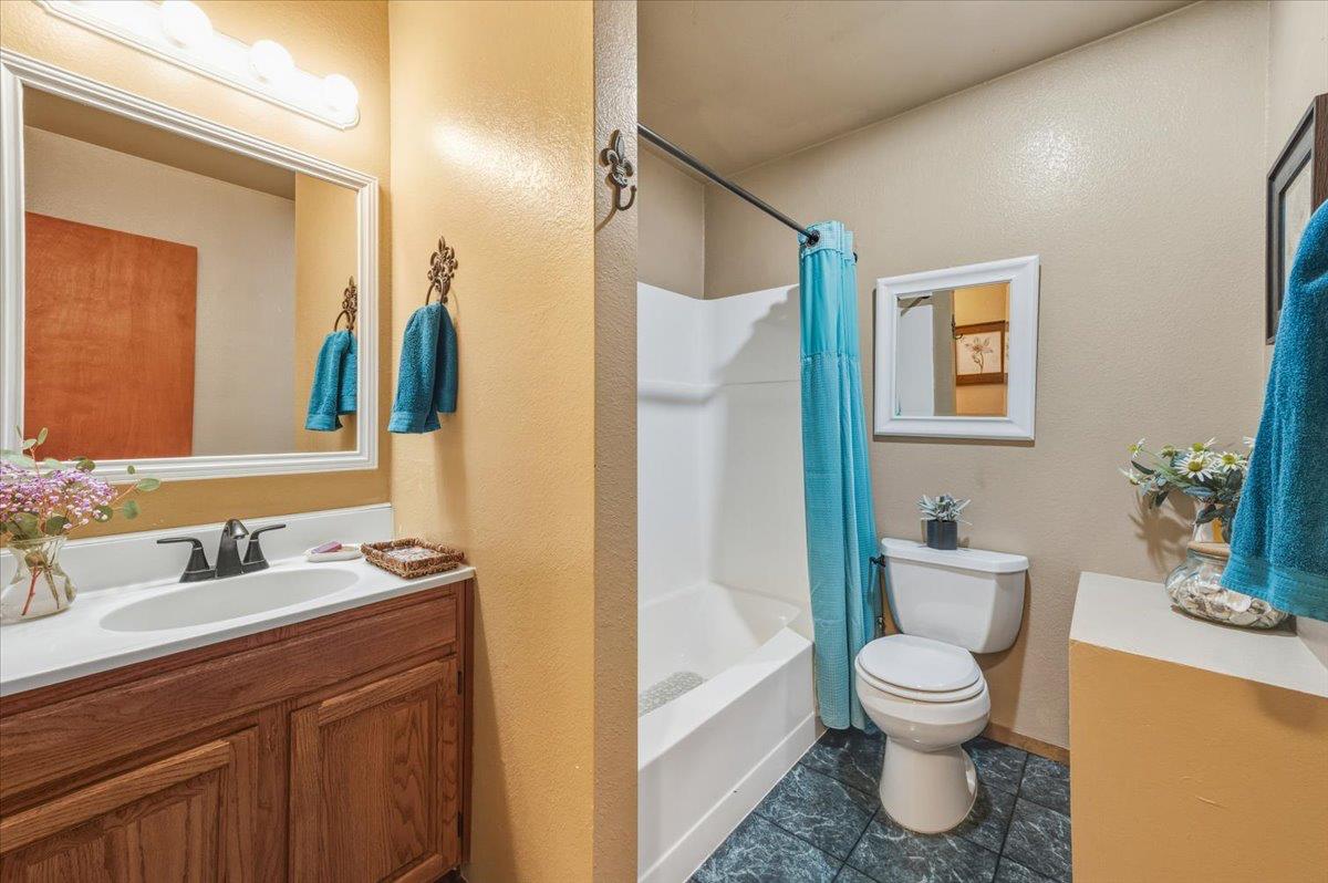 12486 Valley View Road Nevada City, CA 95959 - Photo 18 of 48 a bathroom with a toilet sink and mirror
