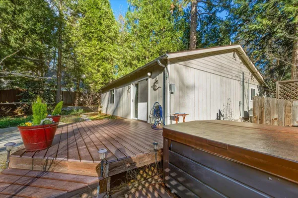 a view of backyard with swimming pool and outdoor seating