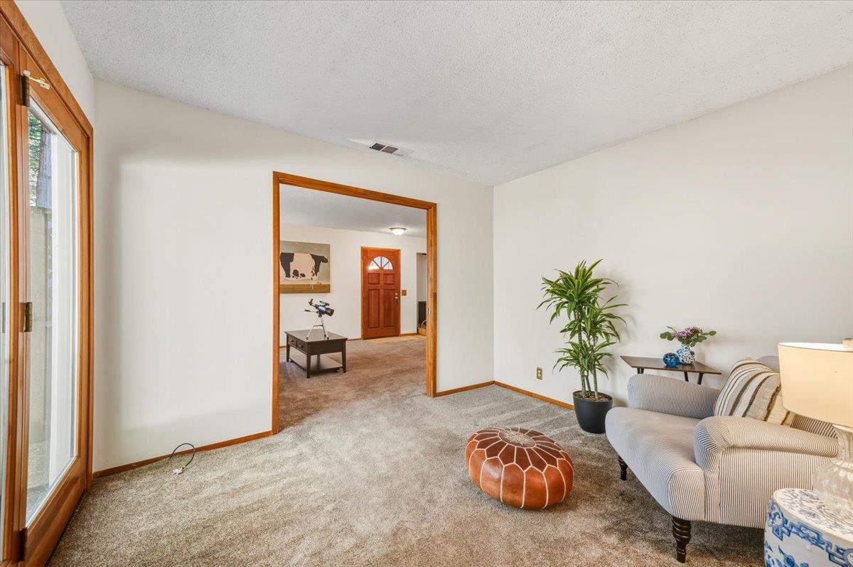 12486 Valley View Road Nevada City, CA 95959 - Photo 7 of 48 a living room with furniture a couch and a potted plant