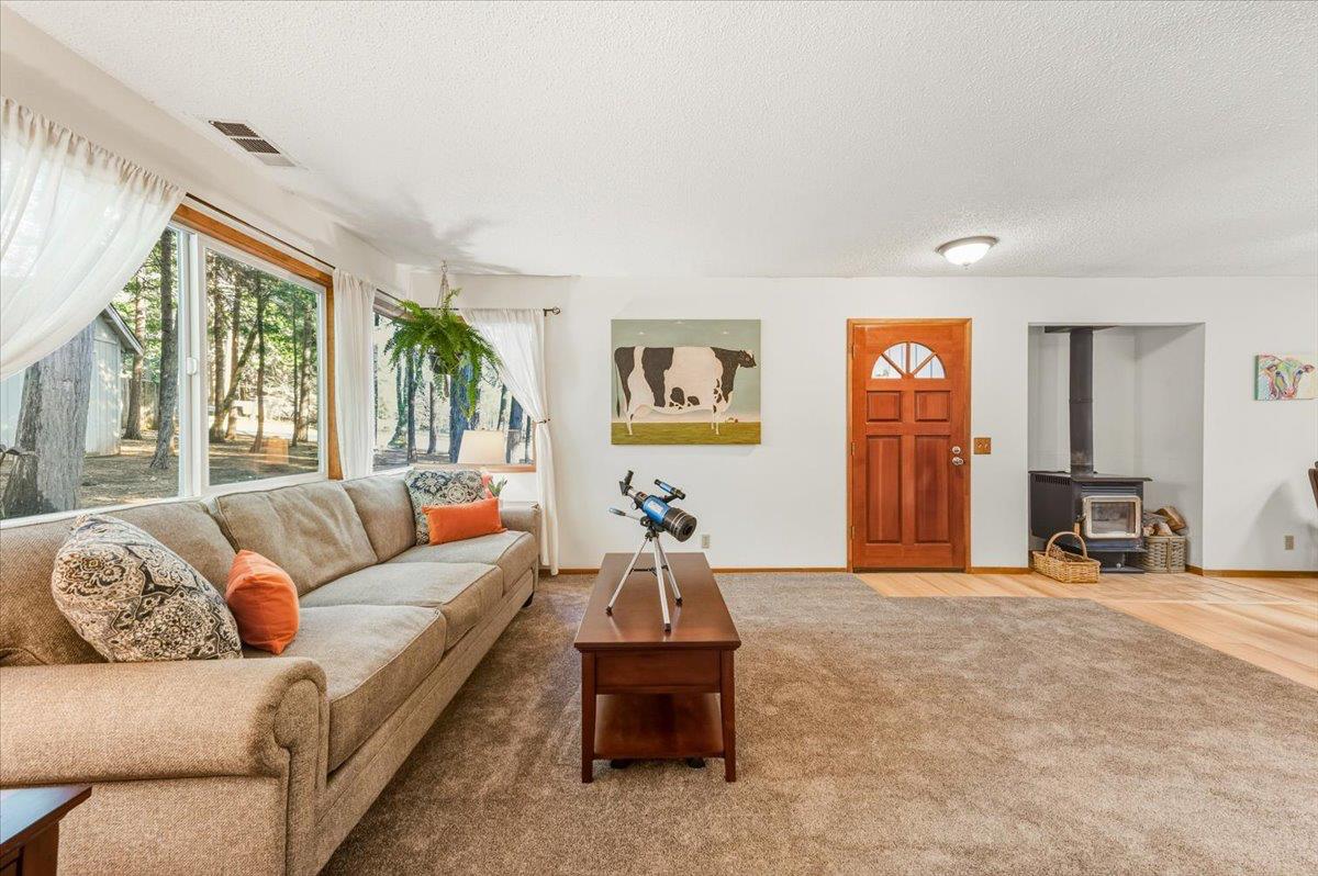 12486 Valley View Road Nevada City, CA 95959 - Photo 8 of 48 a living room with furniture and a large window