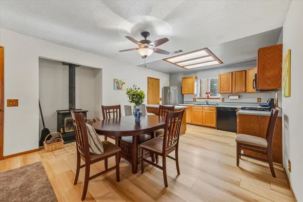 a view of a dining room with furniture and a chandelier