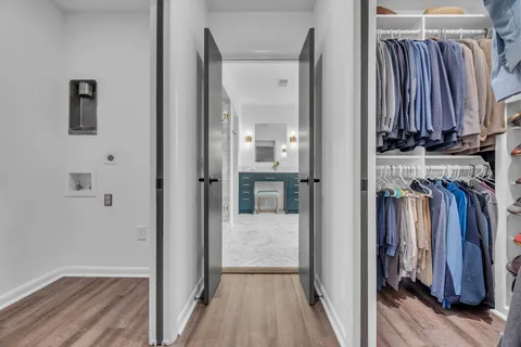a bedroom with a bed and a table in it