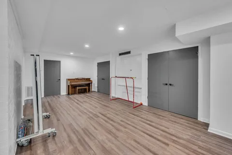 a room with furniture and a floor to ceiling window