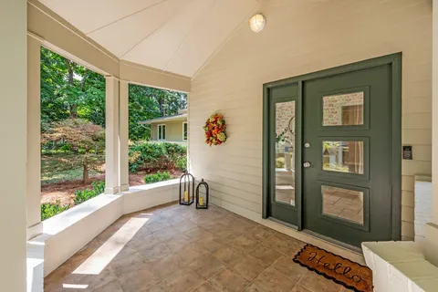 a kitchen with stainless steel appliances granite countertop a sink a stove and a refrigerator