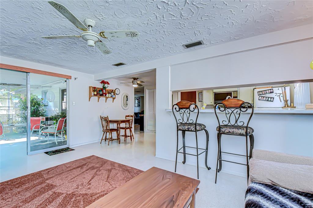 2128 Shannon Drive Holiday, FL 34690 - Photo 11 of 21 a living room with furniture and a flat screen tv