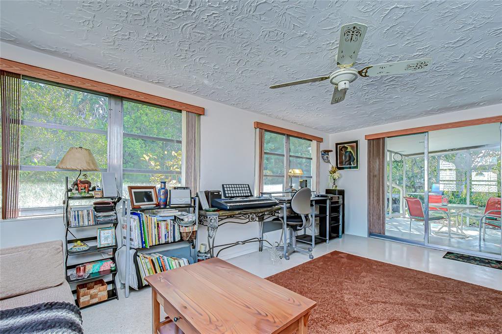 2128 Shannon Drive Holiday, FL 34690 - Photo 12 of 21 a living room with lots of furniture and a large window