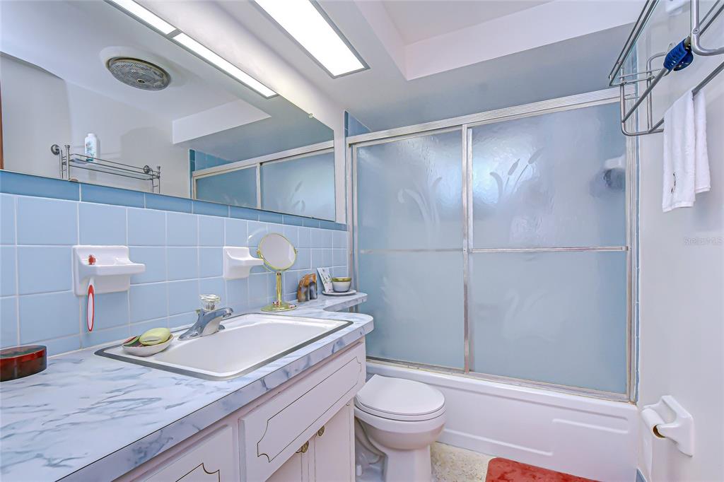 2128 Shannon Drive Holiday, FL 34690 - Photo 16 of 21 a bathroom with a sink toilet and shower