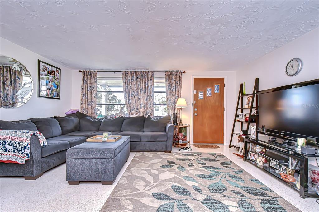 2128 Shannon Drive Holiday, FL 34690 - Photo 4 of 21 a living room with furniture and a flat screen tv