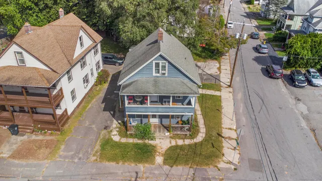 a aerial view of a house with a yard
