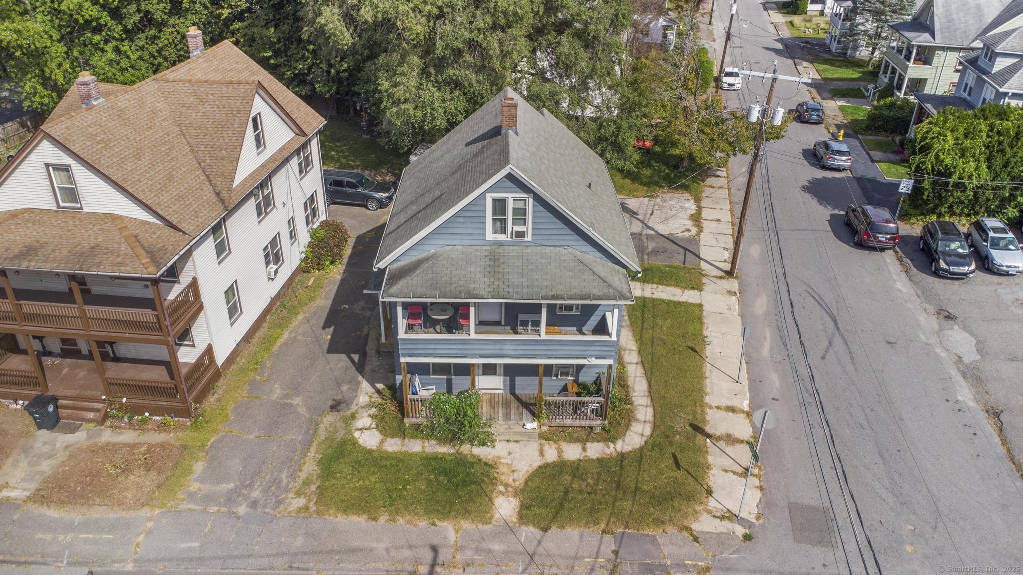 a aerial view of a house with a yard