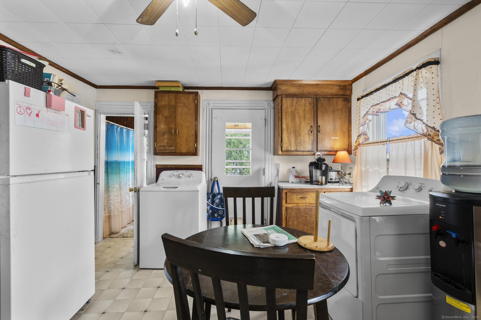 615 South Main Street Torrington, CT 06790 - Photo 11 of 18 a kitchen that has a table and chairs in it