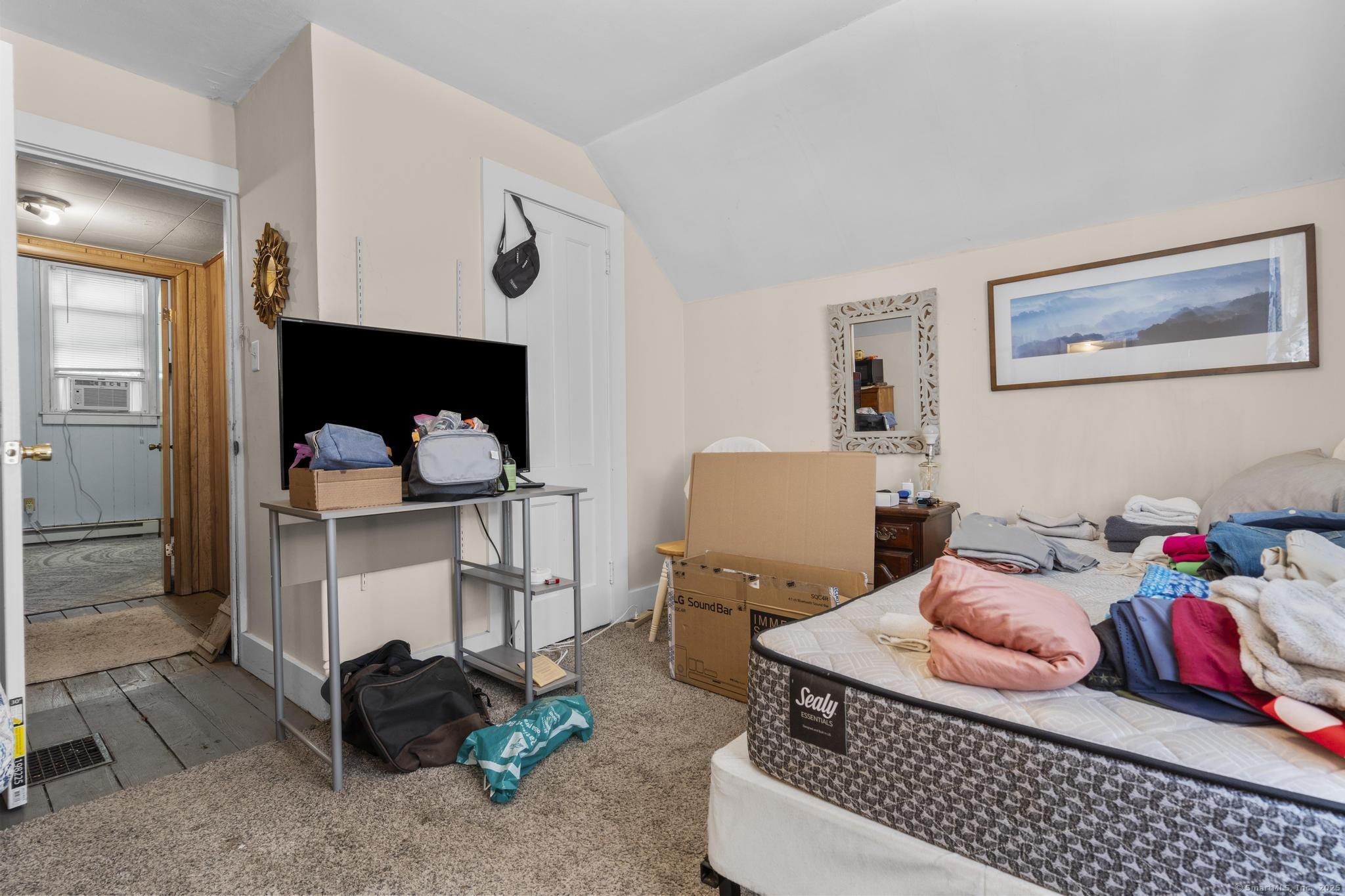 615 South Main Street Torrington, CT 06790 - Photo 16 of 18 a bedroom with furniture and a lamp