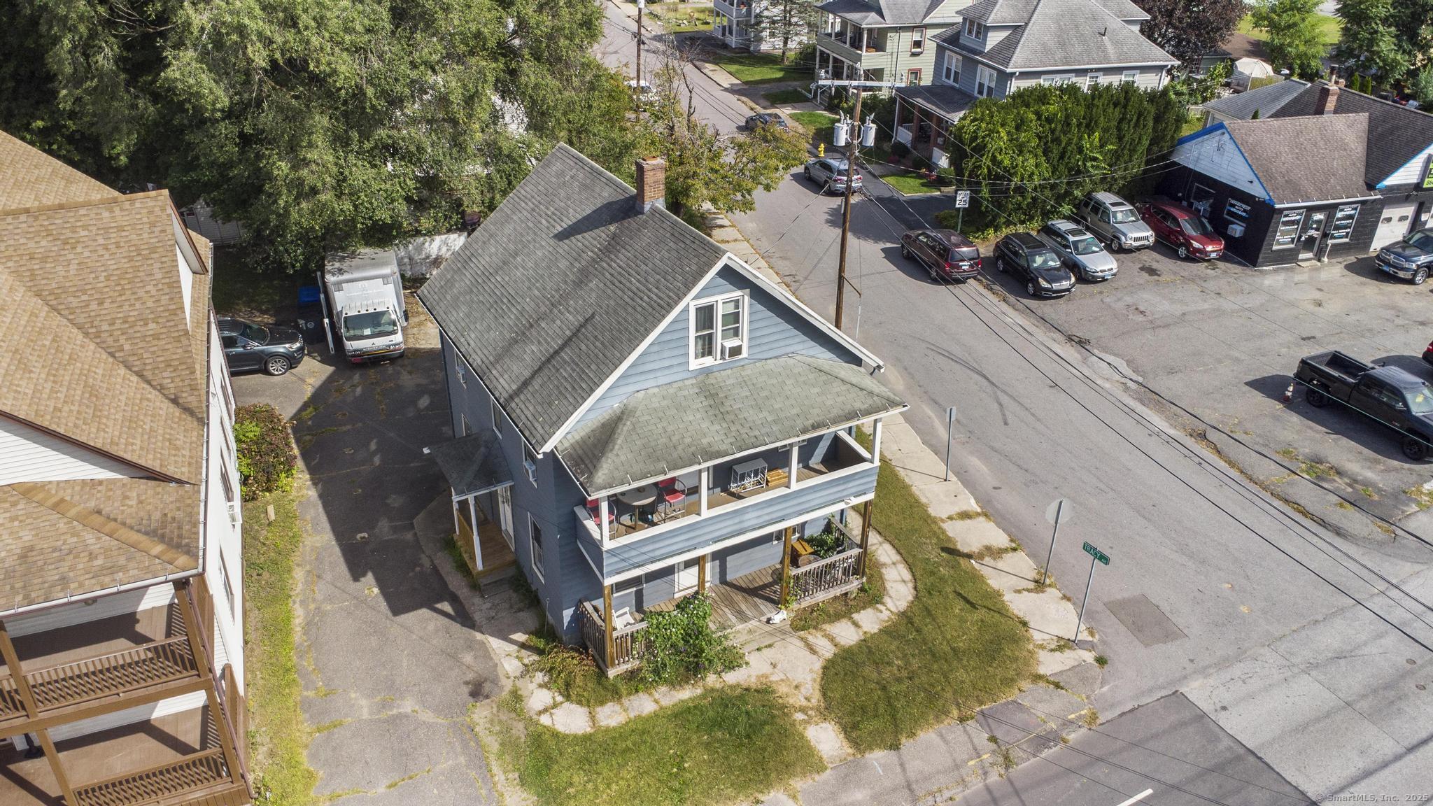 615 South Main Street Torrington, CT 06790 - Photo 2 of 18 an aerial view of a house with a yard and sitting area