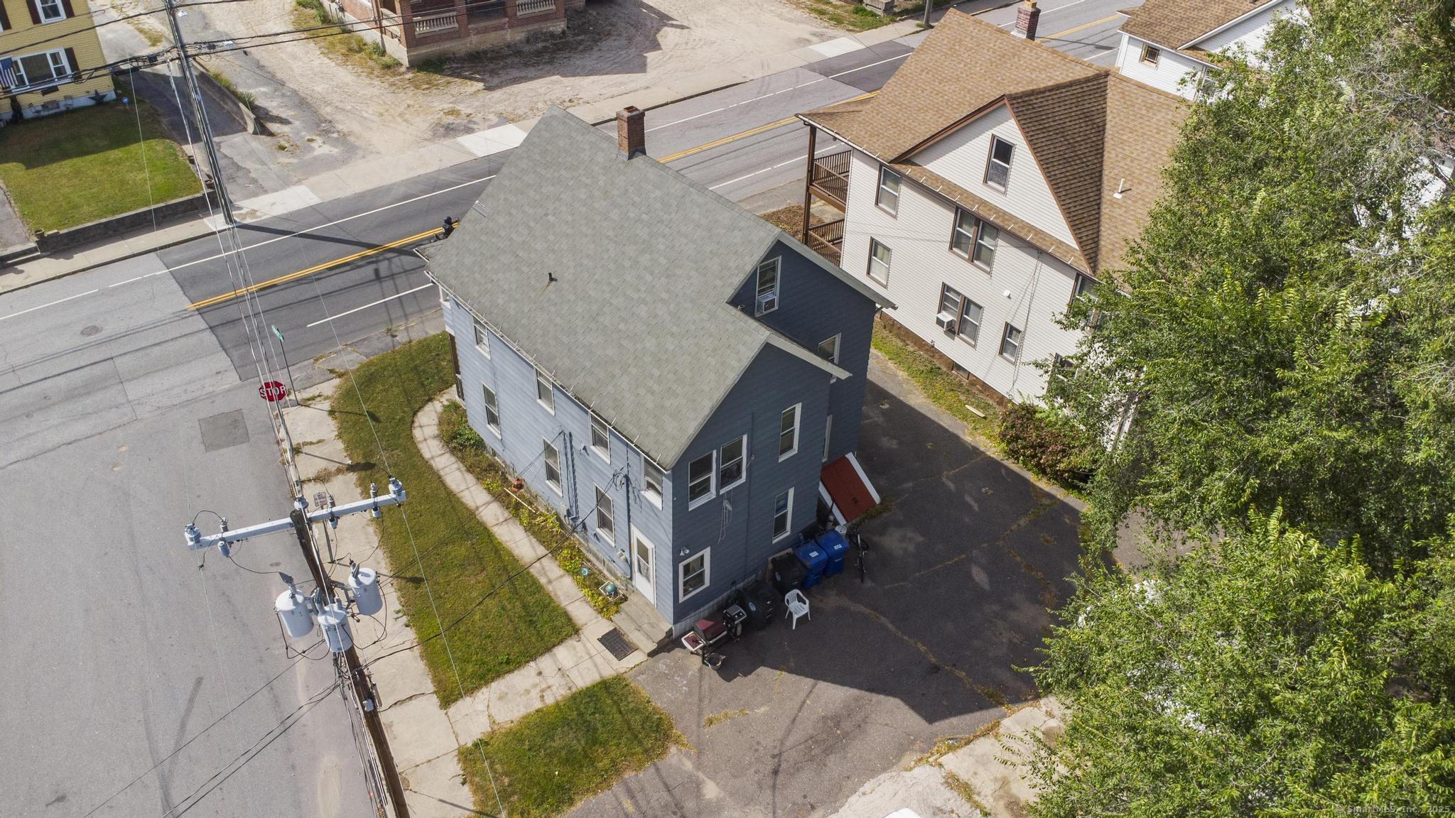 615 South Main Street Torrington, CT 06790 - Photo 3 of 18 an aerial view of a house with a yard