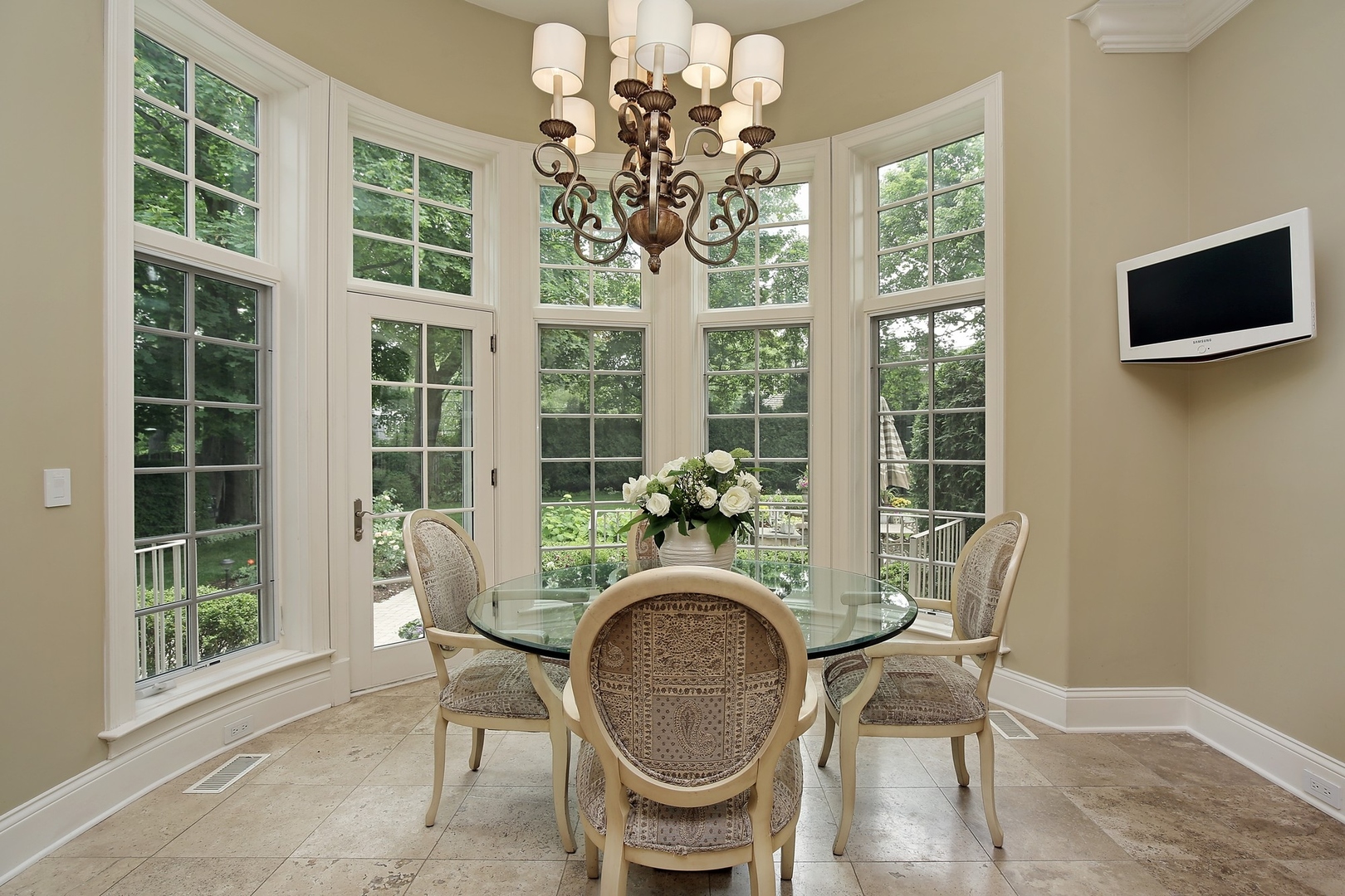 166 Lapier Street Glencoe, IL 60022 - Photo 13 of 32 a view of a dining room with furniture a chandelier and windows